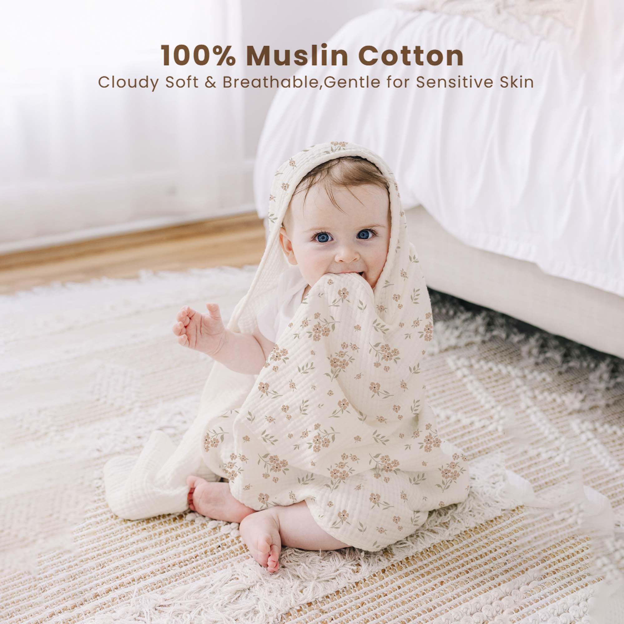 Baby wrapped in blossom hooded towel after bath with hood for added warmth