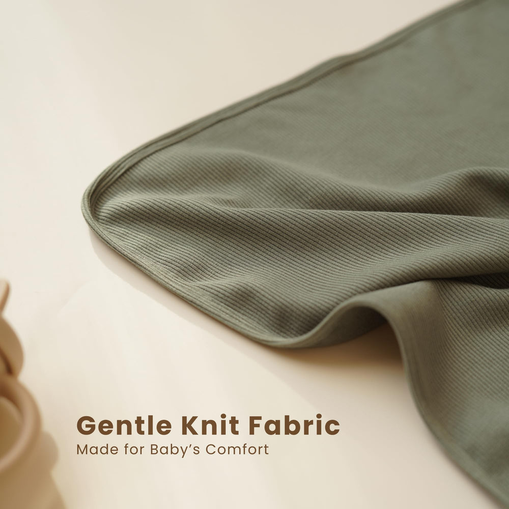 Closeup of Konssy knit baby blanket highlighting ultra-soft knit texture.
