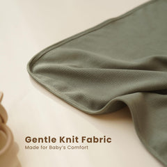 Closeup of Konssy knit baby blanket highlighting ultra-soft knit texture.