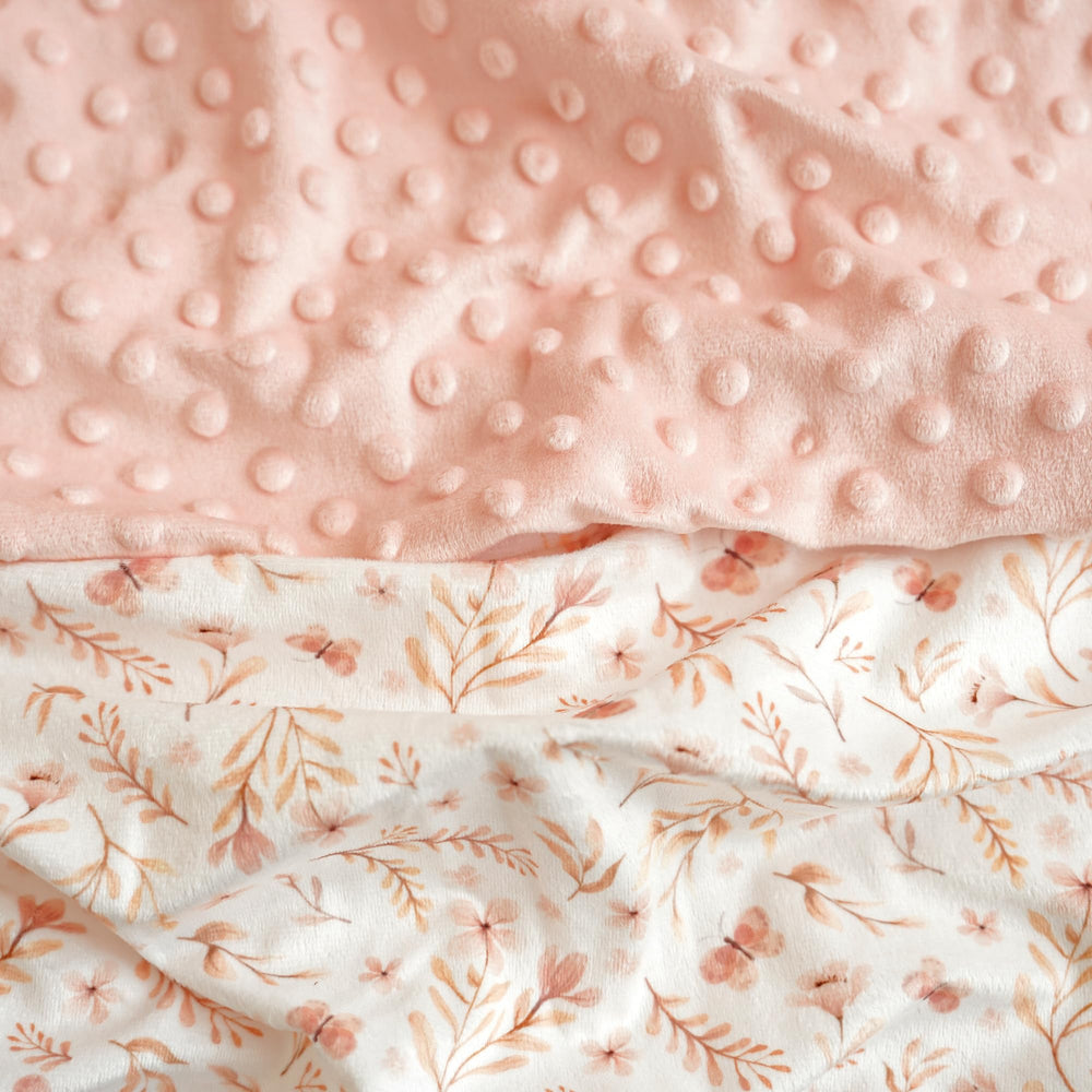 Konssy Minky smooth blush cover for gentle diaper changes.