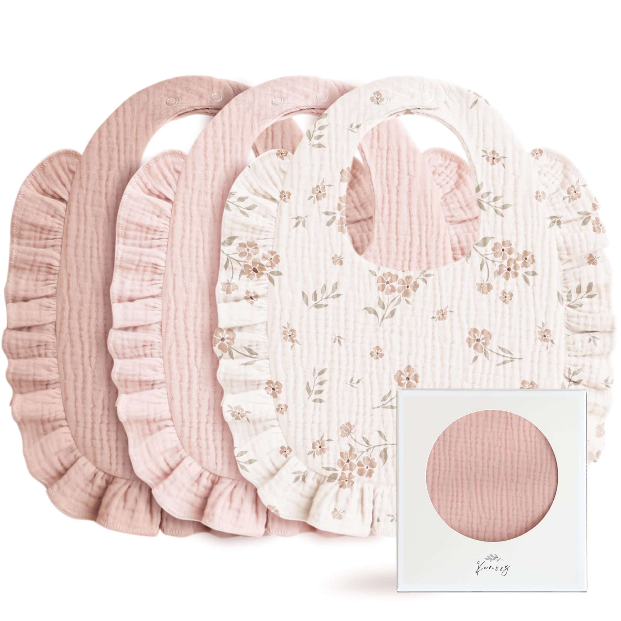 Konssy Muslin bib with pink ruffle trim offers soft skin contact and adorable styling.