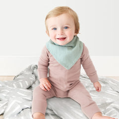 Konssy Muslin bibs laid flat showing unisex colors and soft cotton texture.