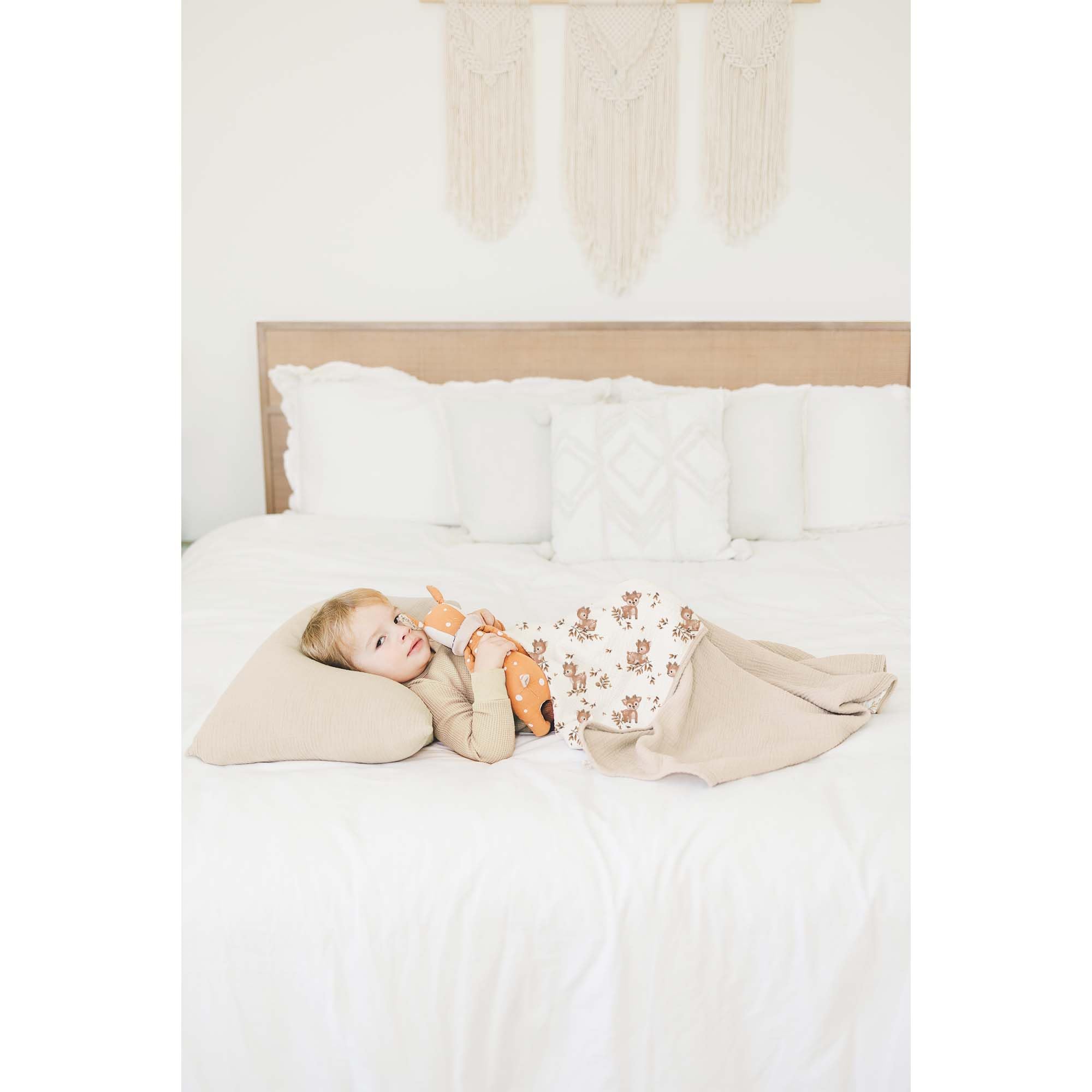 Konssy muslin blanket draped for toddler cuddling and play