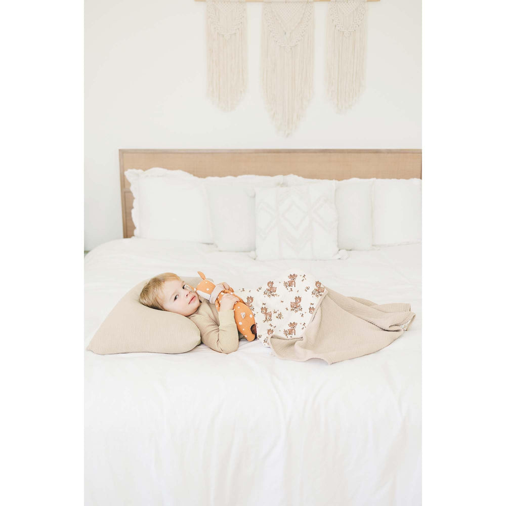 Konssy muslin blanket draped for toddler cuddling and play