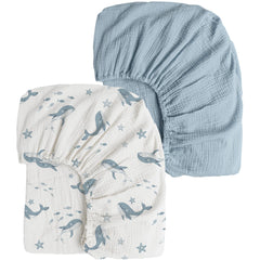 Konssy muslin crib sheets with blue whale print offer breathable comfort for baby sleep.