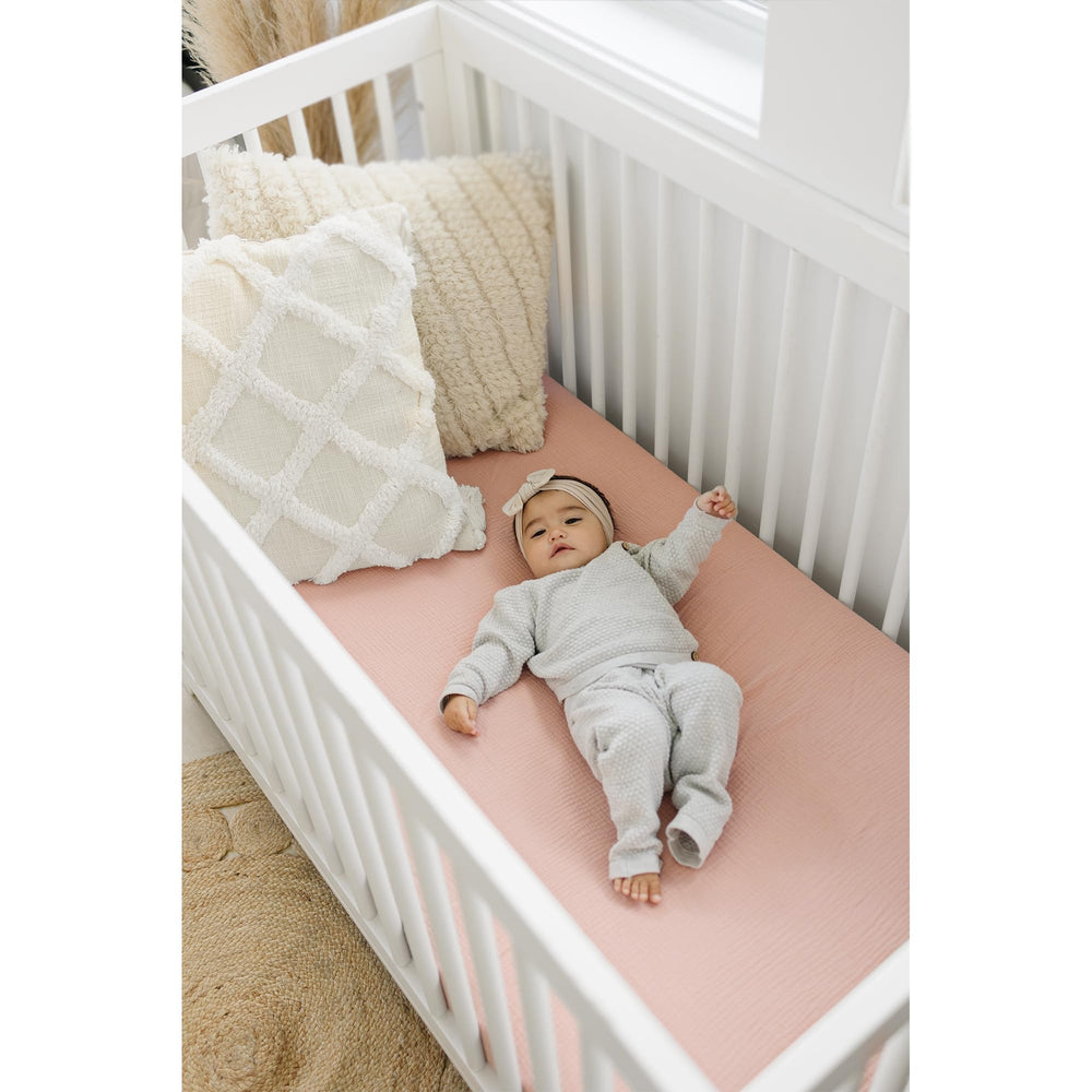Konssy muslin crib sheets offer breathable cotton for baby comfort.