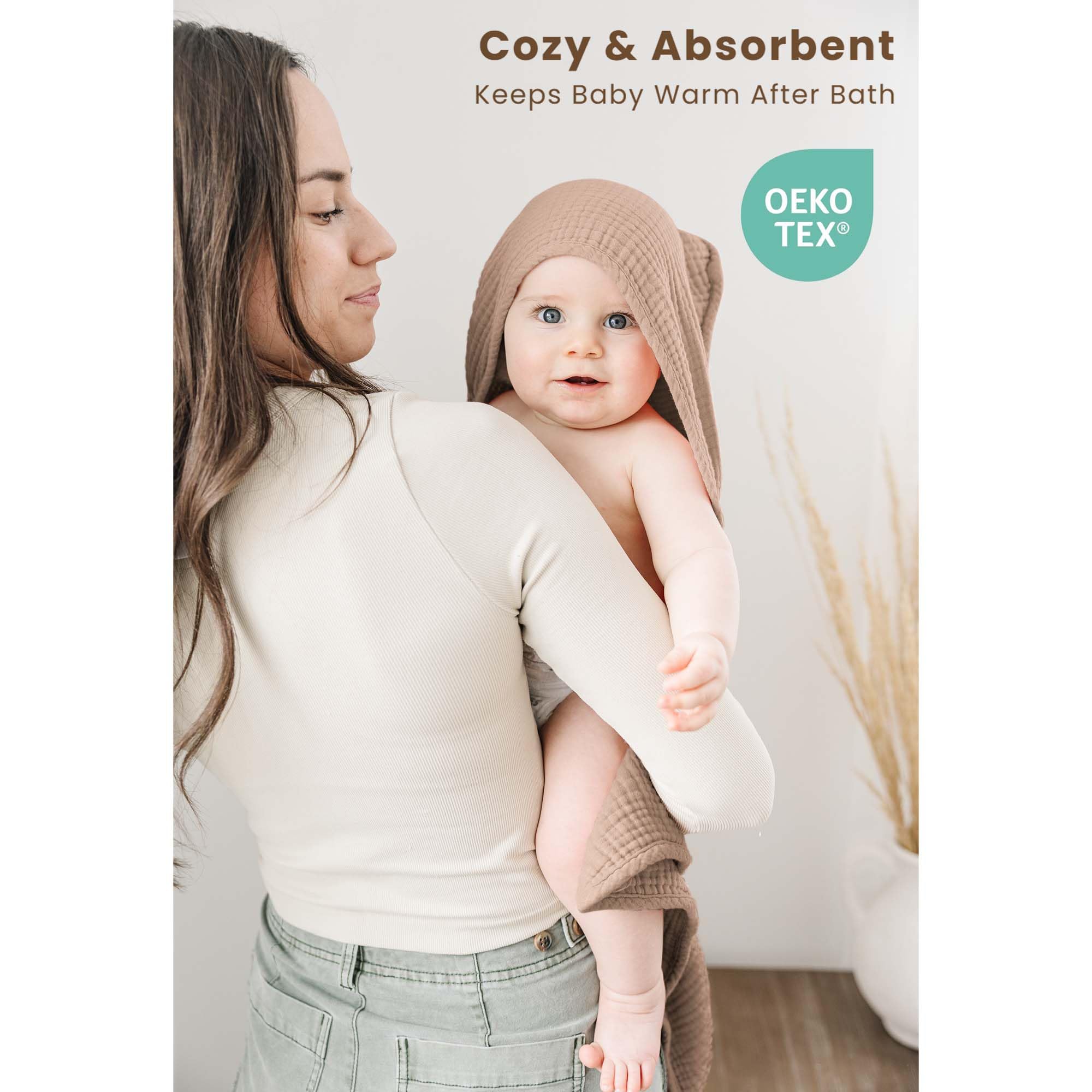 Konssy muslin hooded towel in camel keeps infants warm after bath.