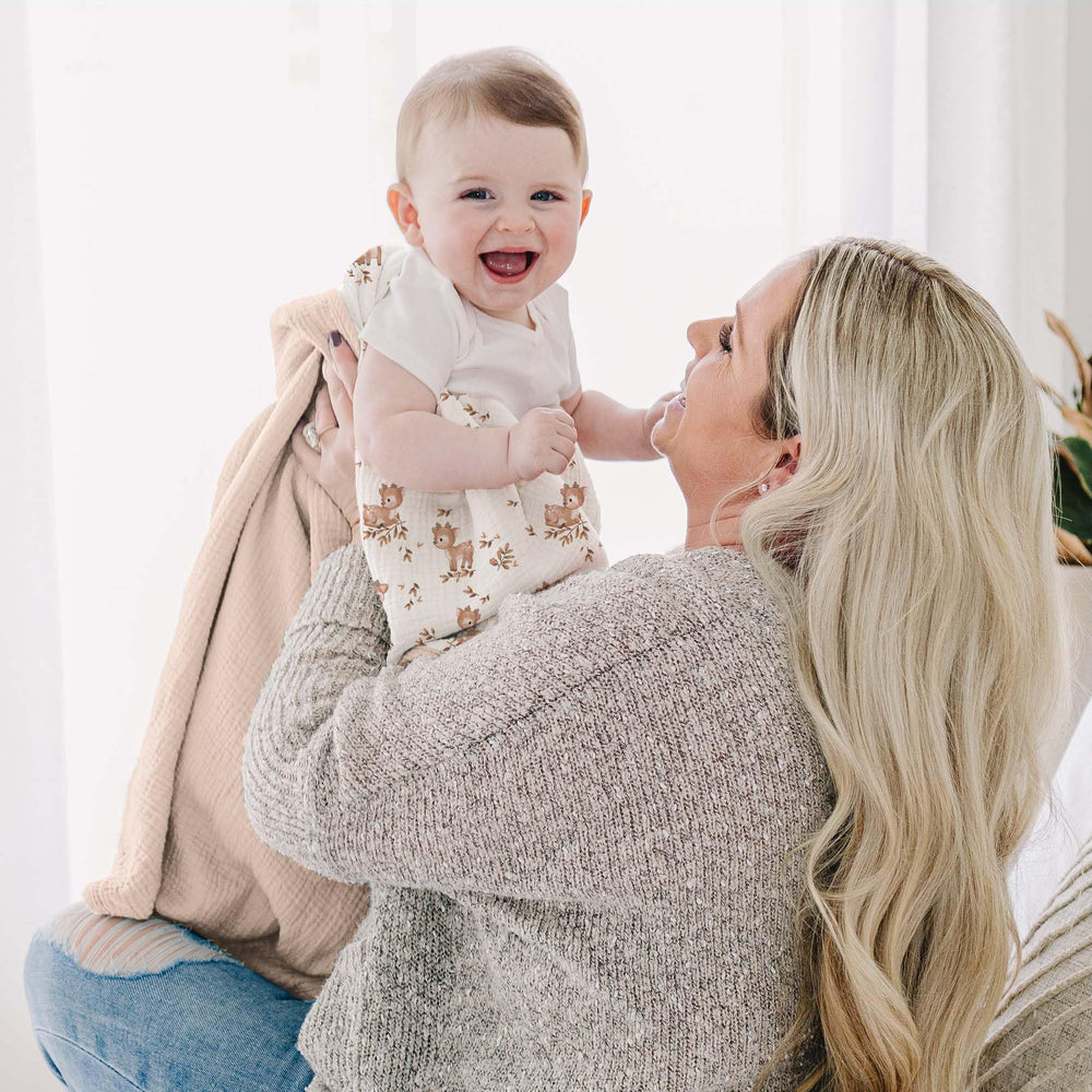 Konssy muslin nursery blanket on crib creates a cozy decorative scene
