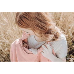 Konssy Muslin Nursing Cover acting as car seat canopy on the go.