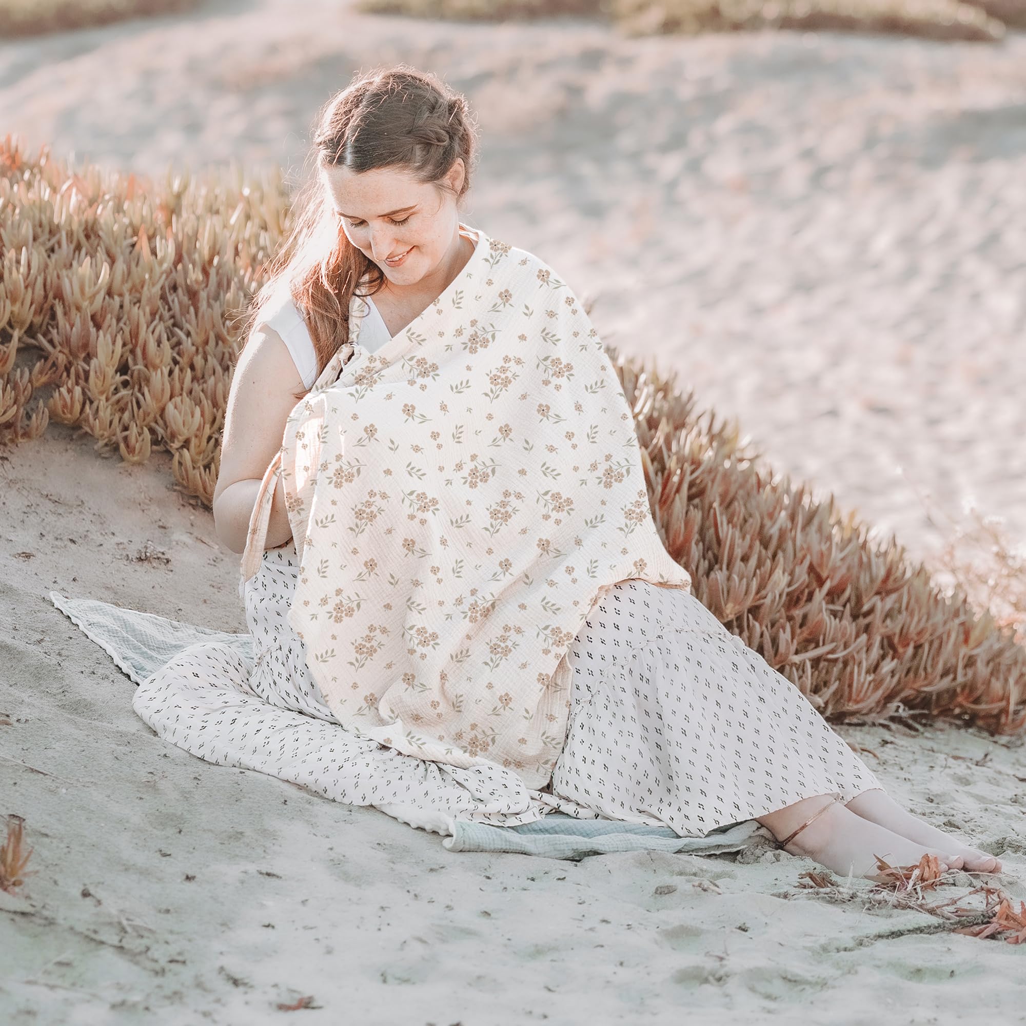 Konssy muslin cover doubles as car seat and stroller cover for on-the-go feeding.