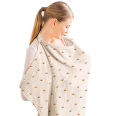 Konssy Muslin nursing cover over baby for discreet feeding.