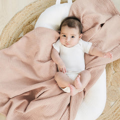 Konssy muslin swaddle neutral color blanket versatile for swaddling or nursing cover.