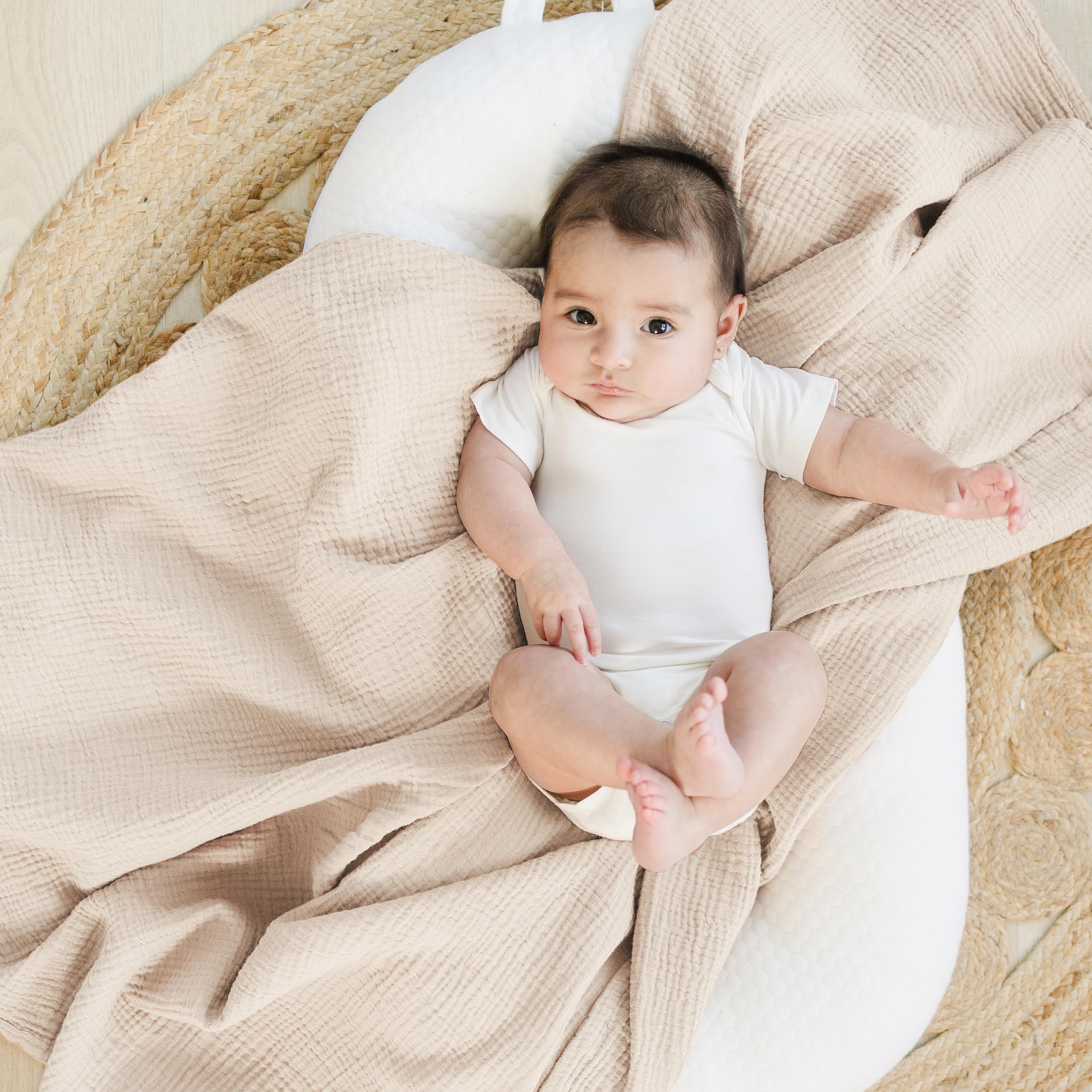 Konssy blossom-pattern muslin swaddle blanket adds color and cozy swaddling for baby.
