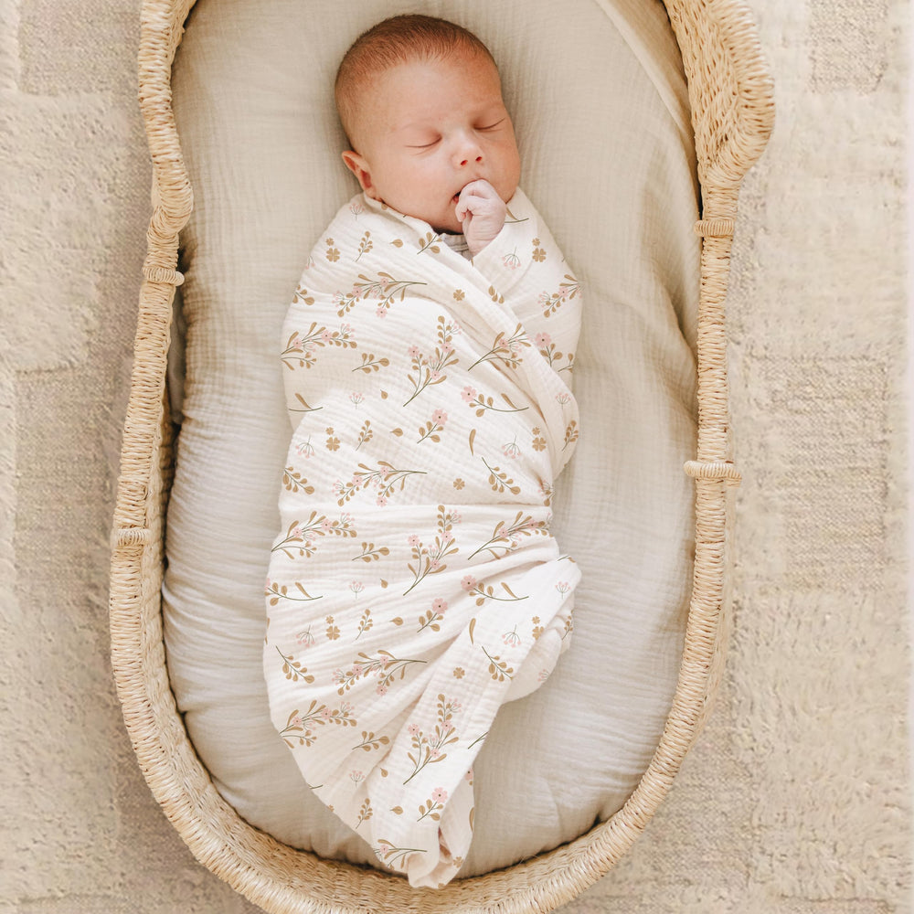 Close-up texture of Konssy muslin swaddle blanket showing lightweight cotton weave.