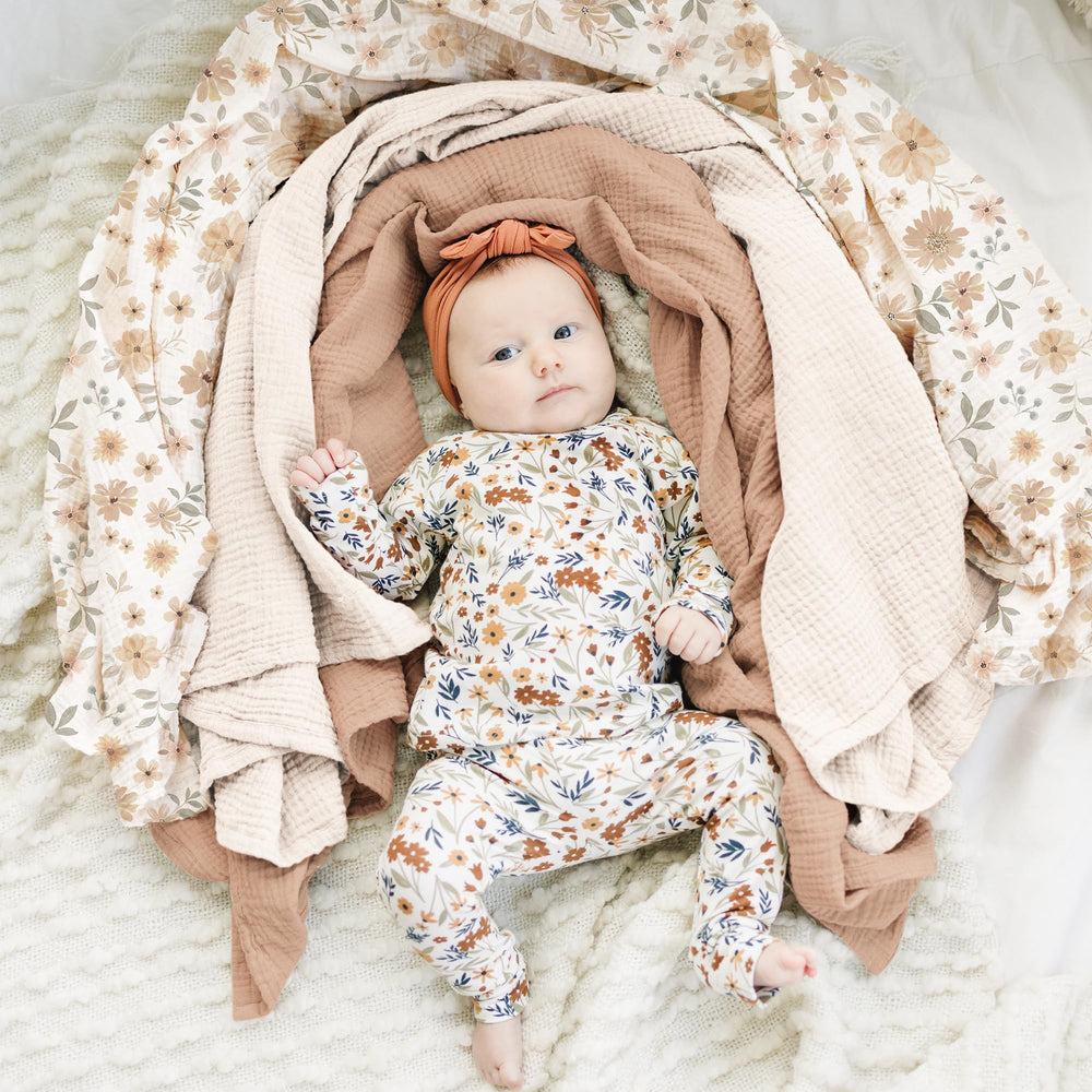 Konssy muslin swaddle blanket folded to reveal 47x47 inch large size