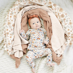 Konssy muslin swaddle blanket folded to reveal 47x47 inch large size