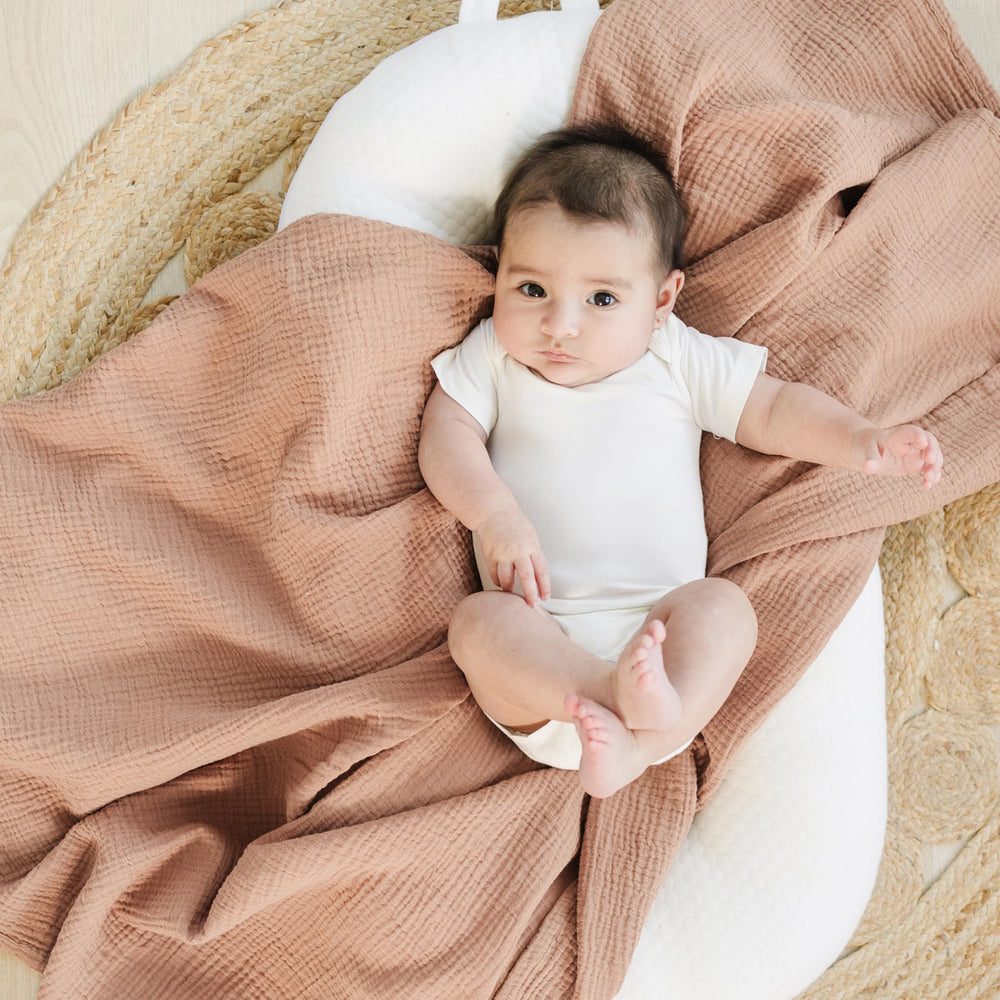 Konssy 47 by 47 swaddle blanket offers a large wrap for secure swaddling.