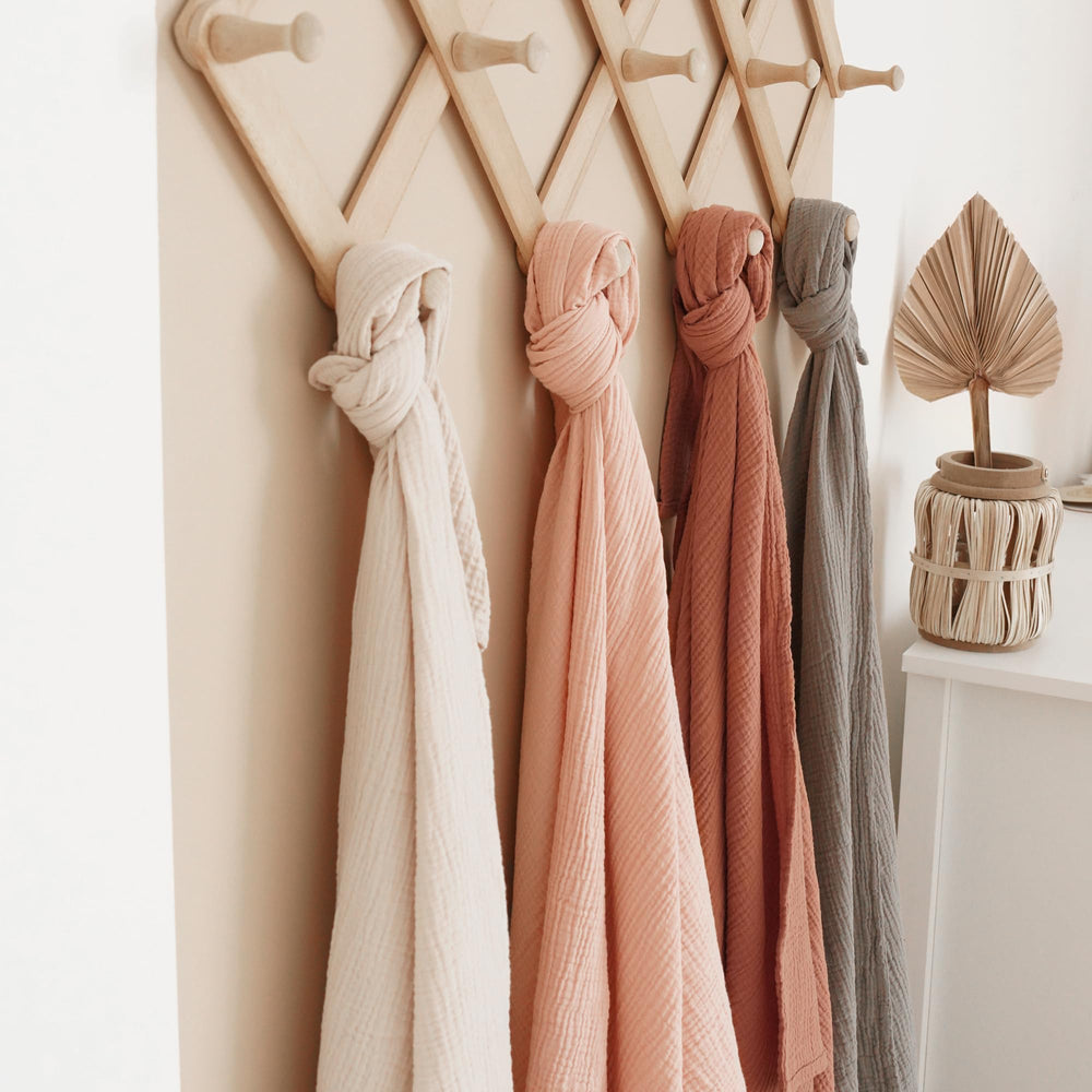 Konssy swaddle wrapped around baby for snug, cozy moments.