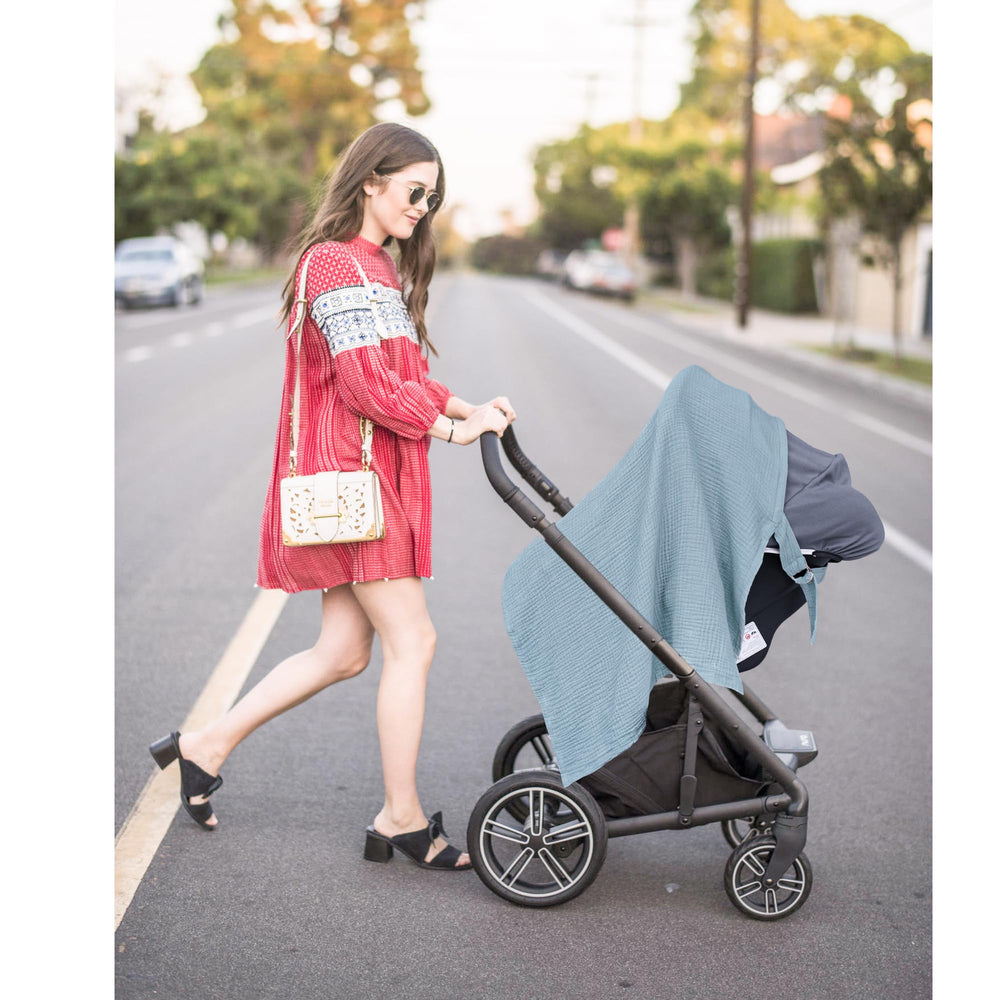 Konssy nursing cover doubles as stroller or canopy for versatile use.