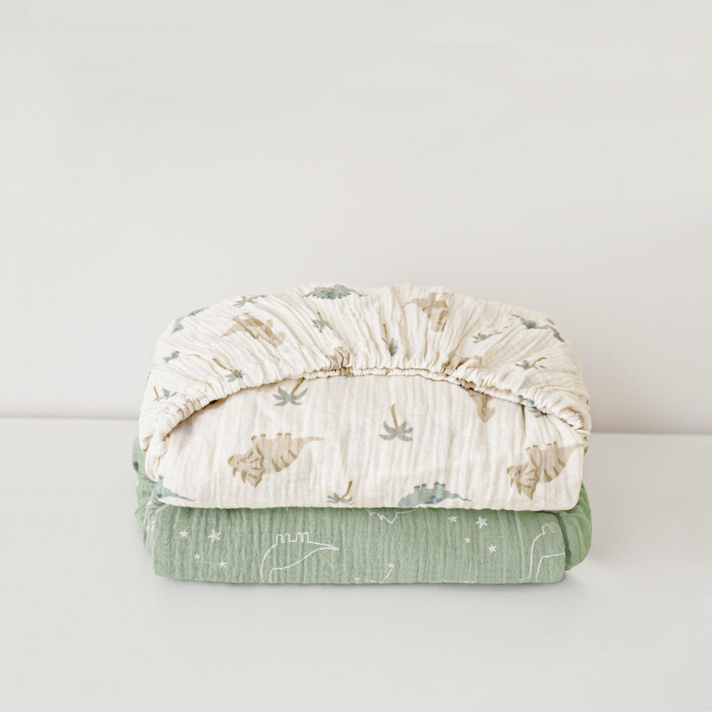 Konssy Sage Dino crib sheet in neutral tones suits any nursery