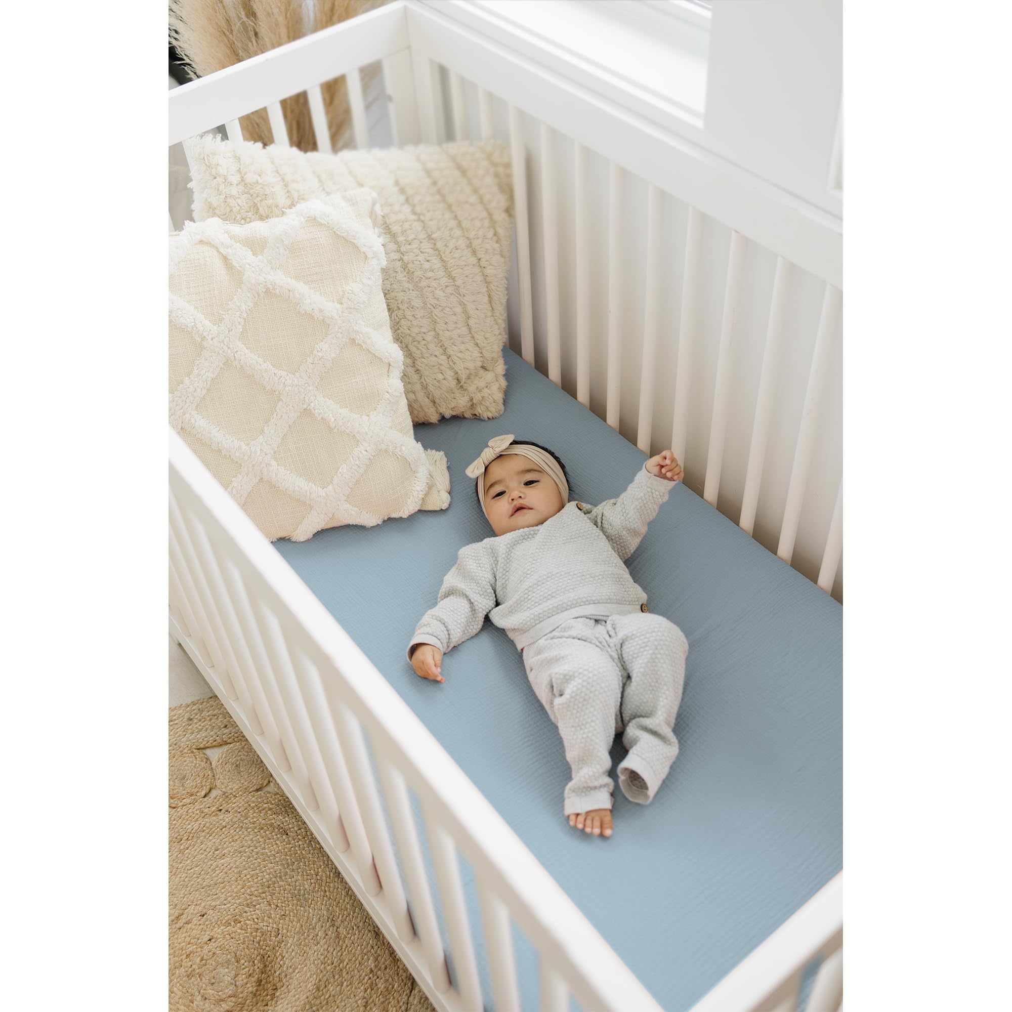Close-up of soft, 100% cotton muslin fabric gentle on newborn skin.