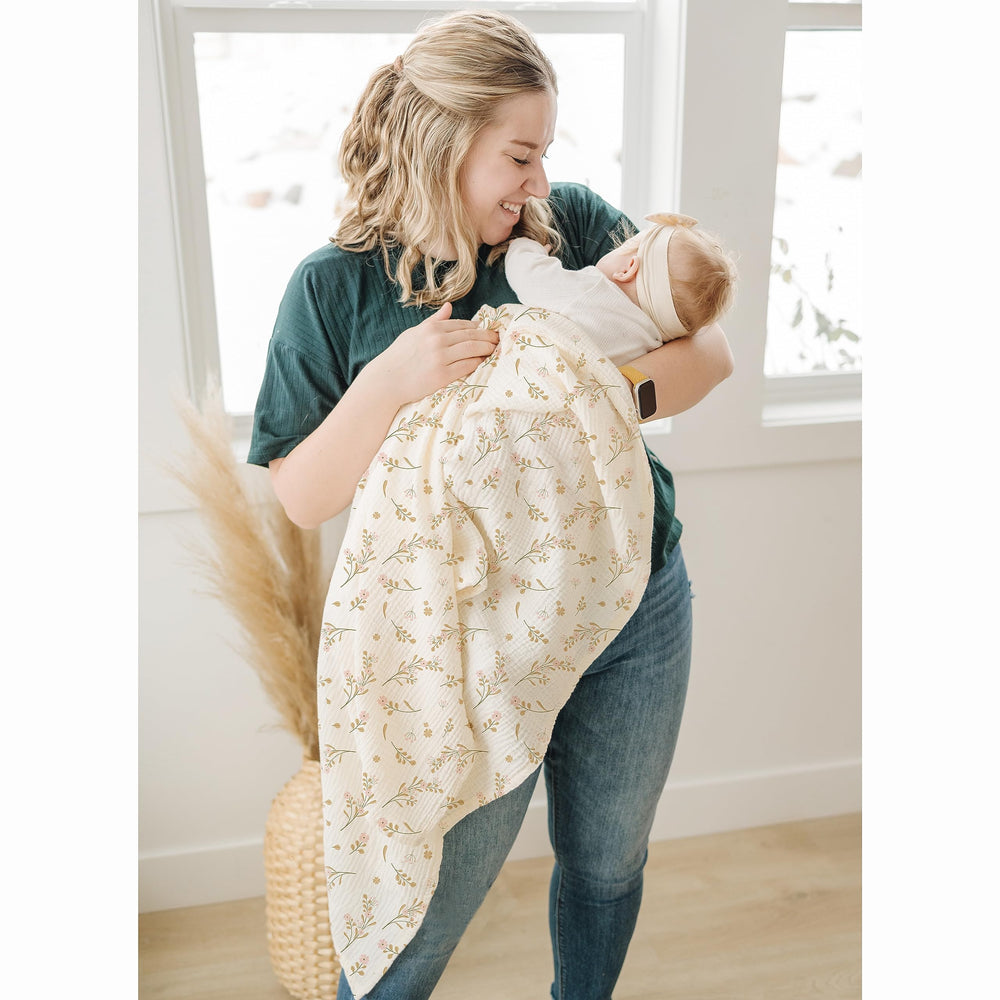 Konssy stroller shade and tummy-time blanket for outdoor moments.