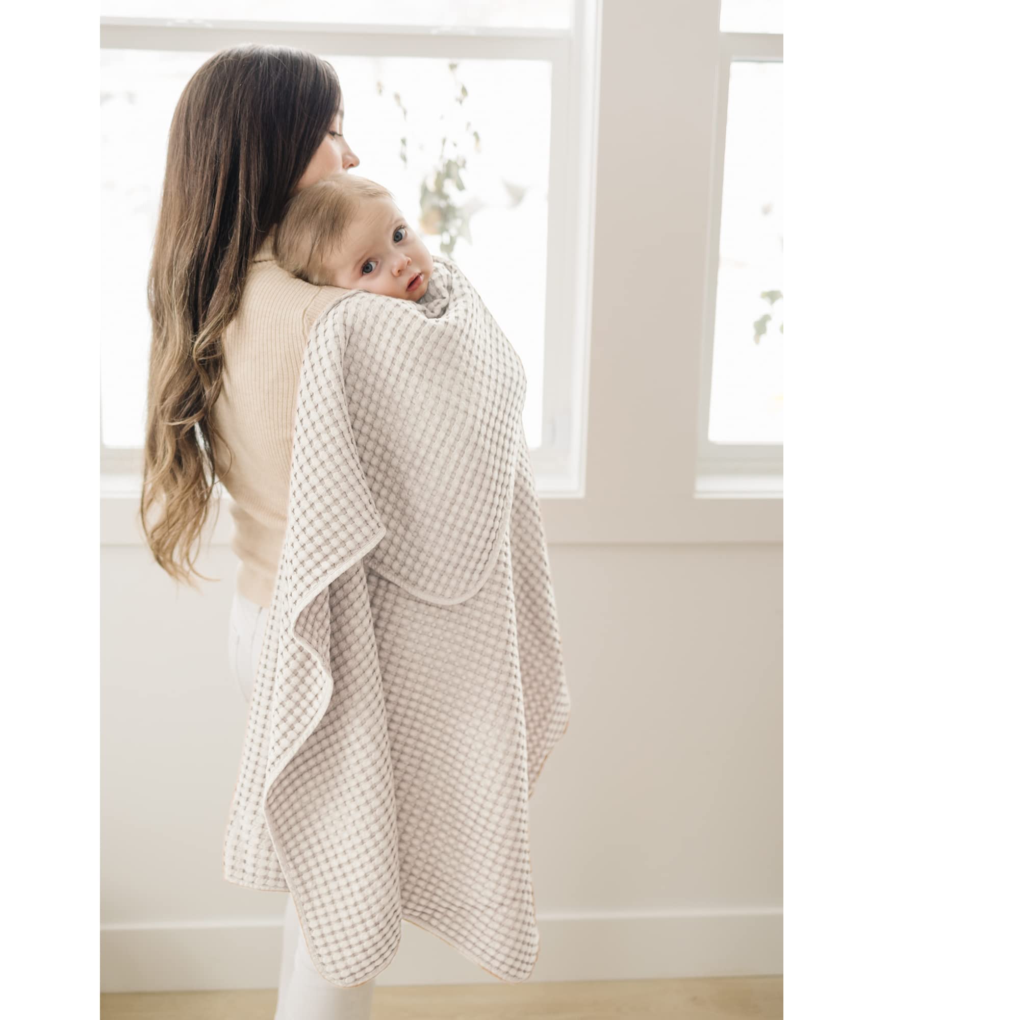 Konssy Waffle Baby Blanket flatlay in oat color, versatile accessory.