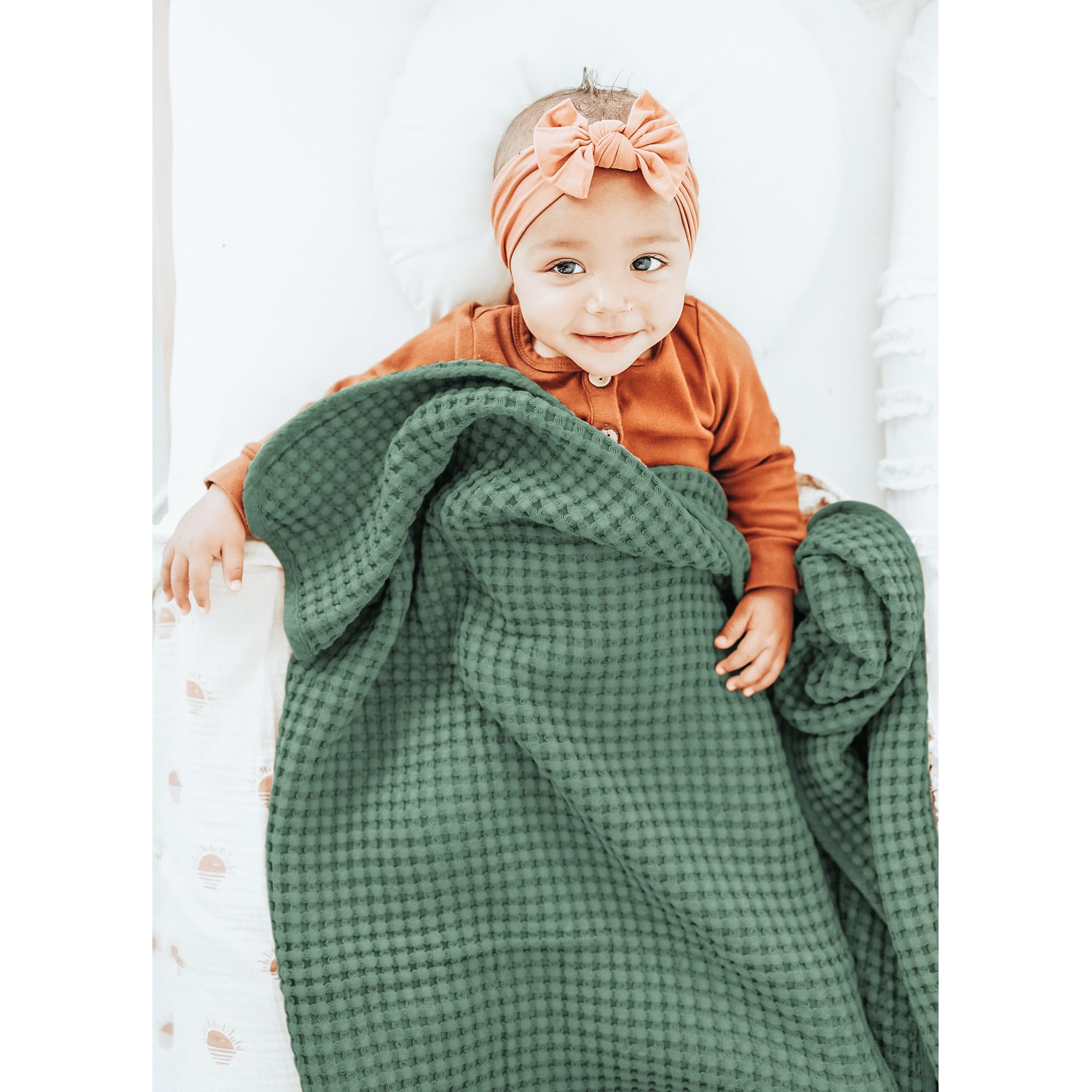 Konssy waffle baby blanket in stroller for on-the-go comfort.