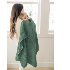 Konssy waffle baby blanket swaddle mode, ideal for calm wrapping.