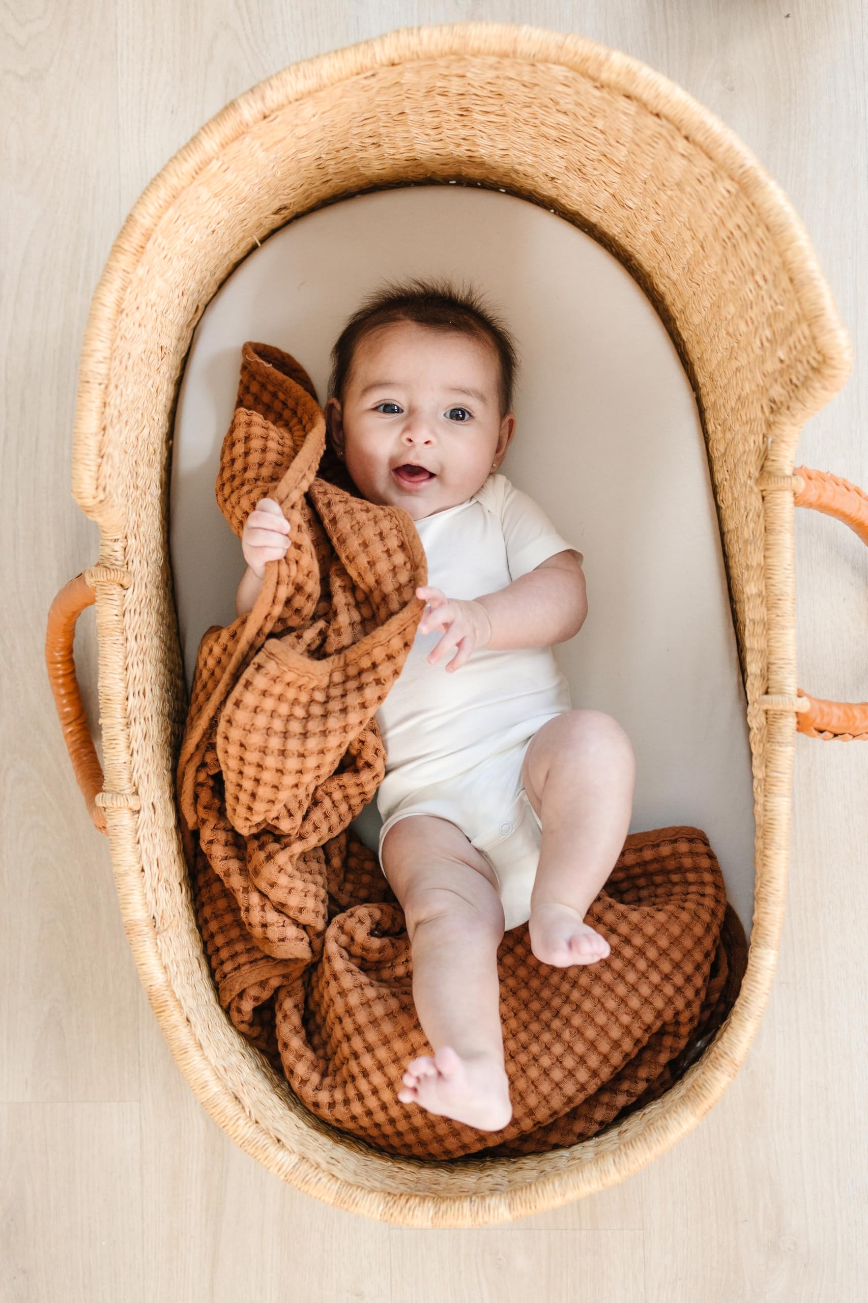Konssy waffle blanket multi use close up showing swaddle and stroller use