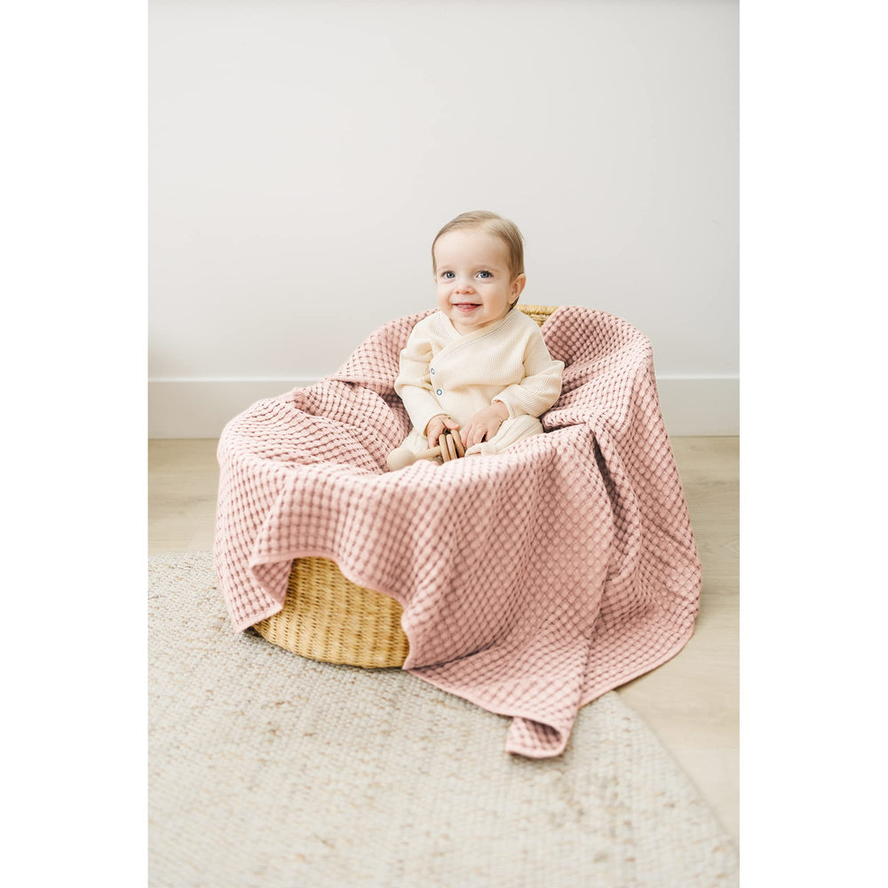 Konssy Waffle Baby Blanket pink photography prop for adorable newborn shots.