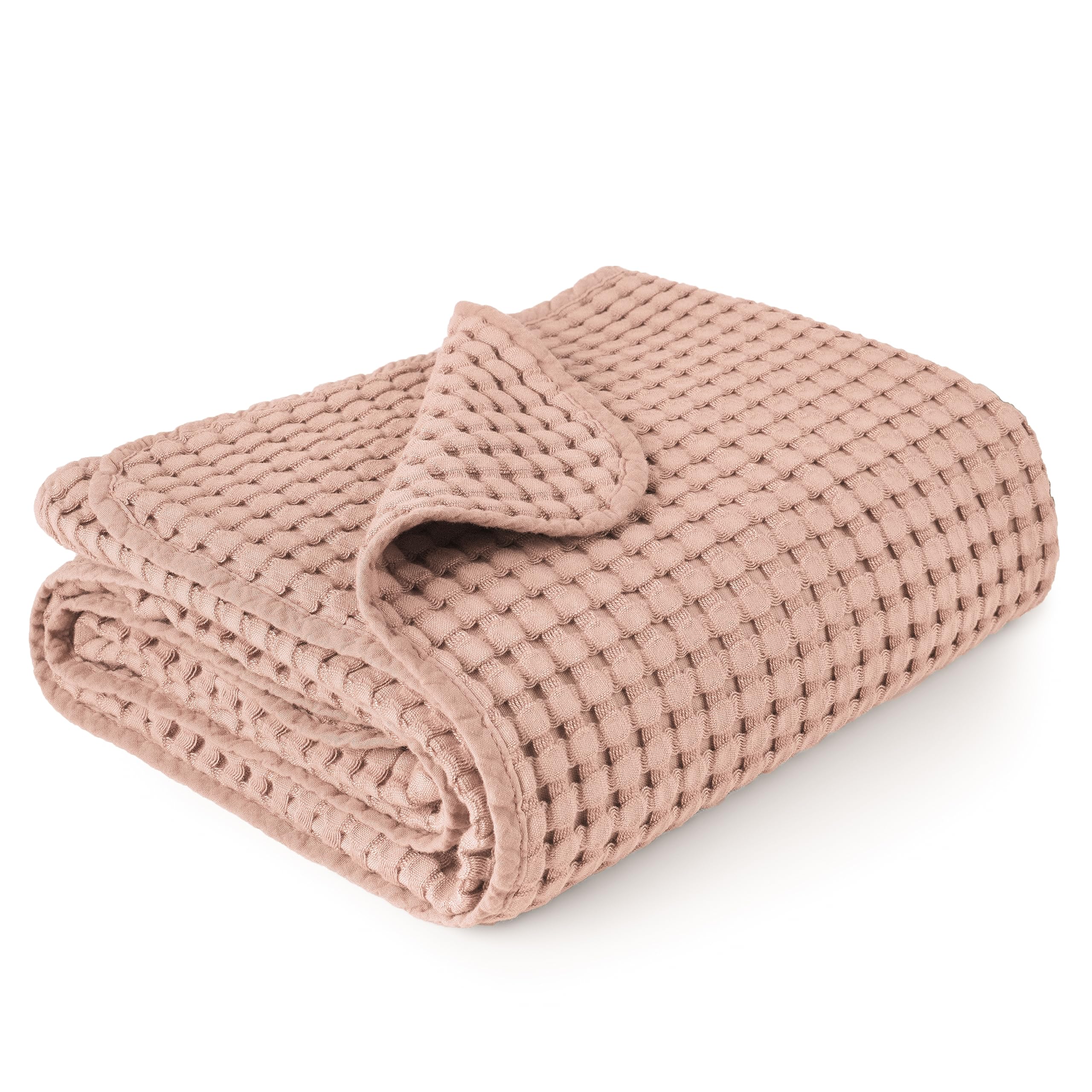 Konssy waffle baby blanket in blush pink shows soft, cozy texture for nap time.