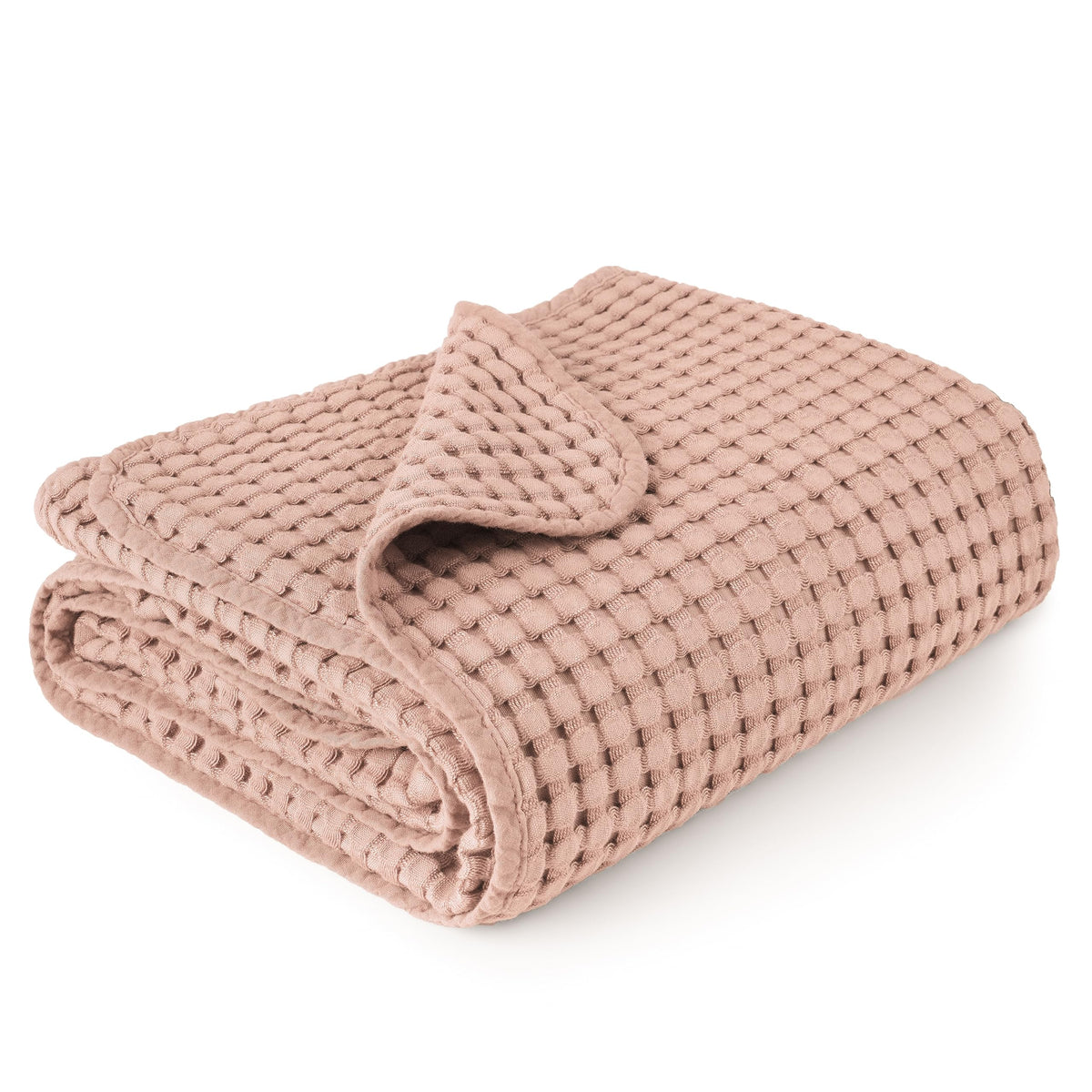 Konssy waffle baby blanket in blush pink shows soft, cozy texture for nap time.