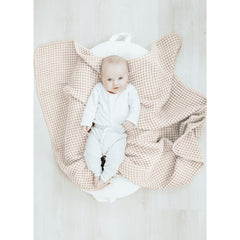 Konssy Waffle Baby Blanket used as swaddle wrap for nap time.