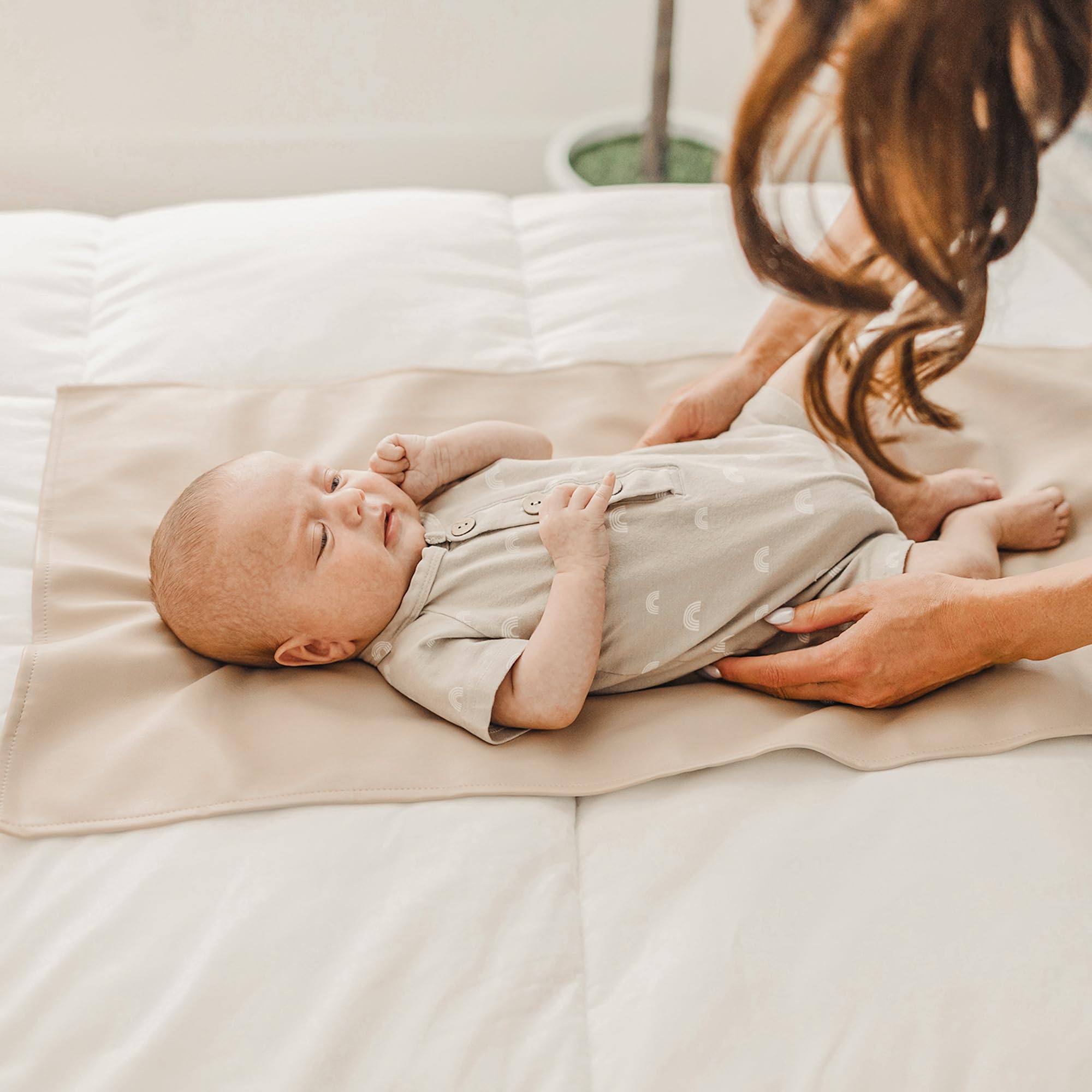 Konssy wipe-clean changing mat with unisex design for any nursery.