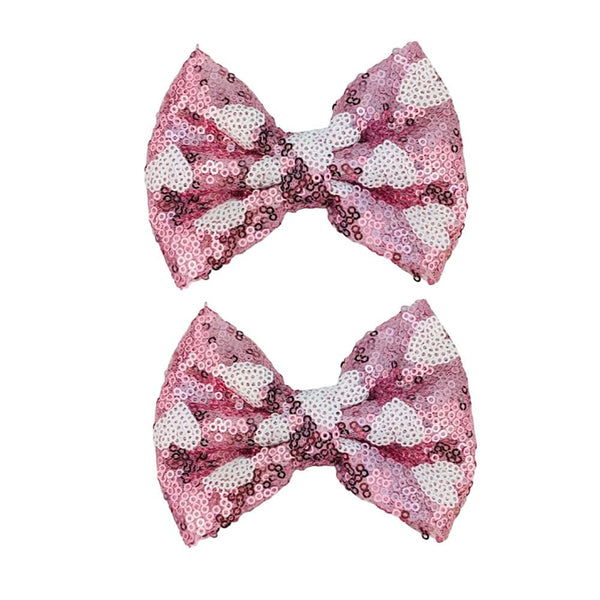 Koolgil pink heart glitter bow hair clip adds sparkle and holds hair in place.