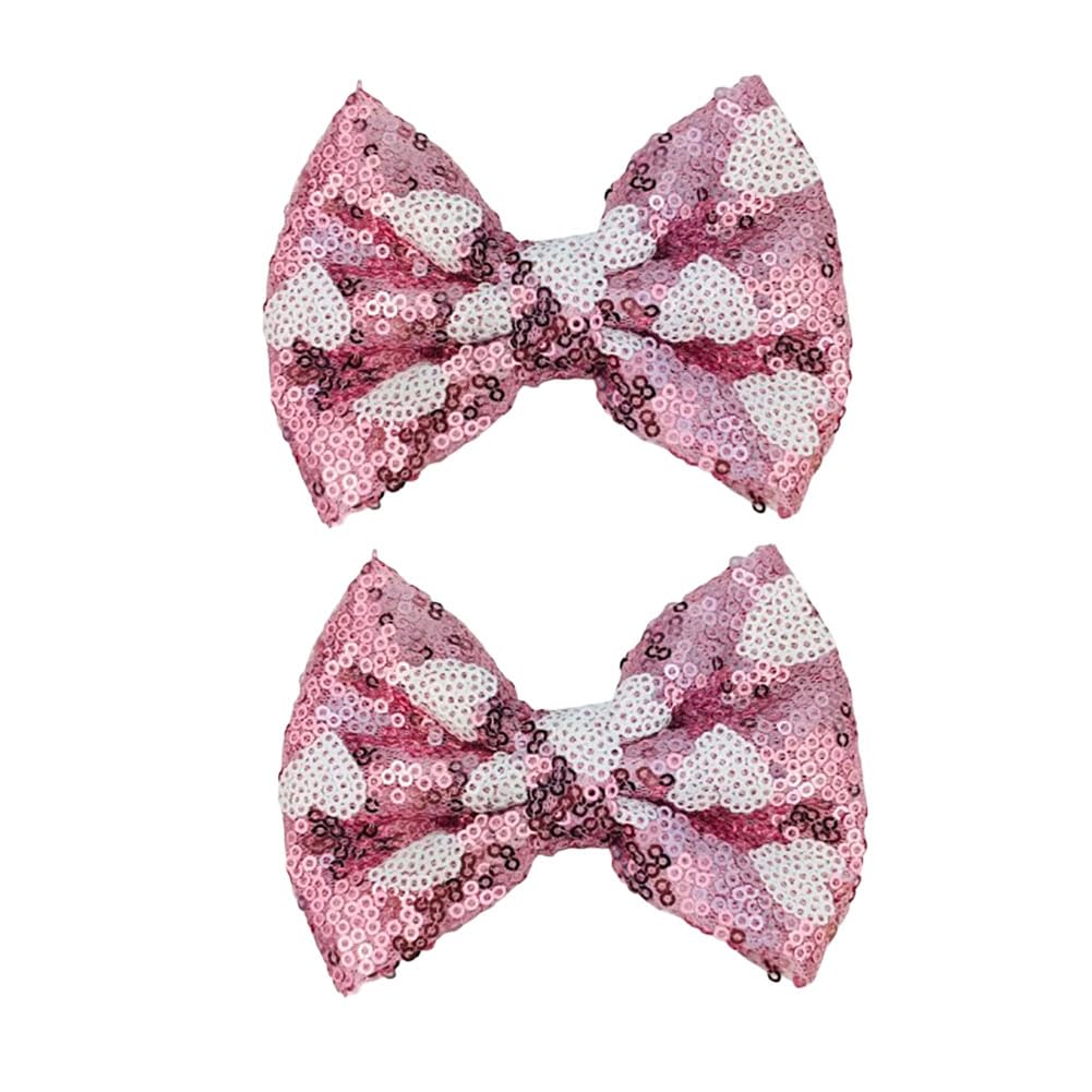 Koolgil pink heart glitter bow hair clip adds sparkle and holds hair in place.