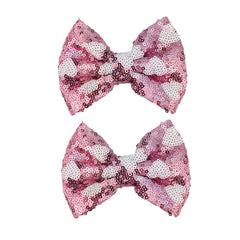 Koolgil pink heart glitter bow hair clip adds sparkle and holds hair in place.