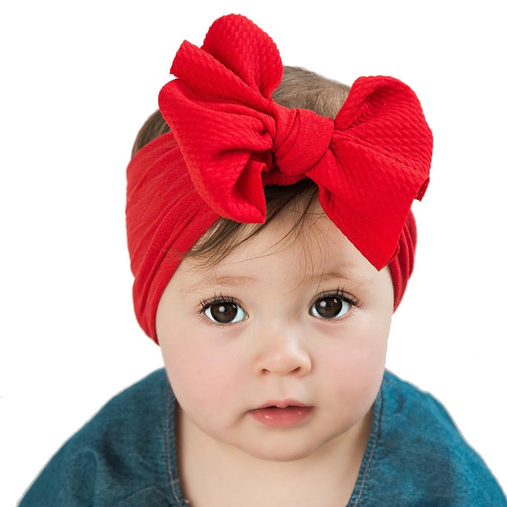 Koolgil baby headband yellow color worn by a toddler during playtime.