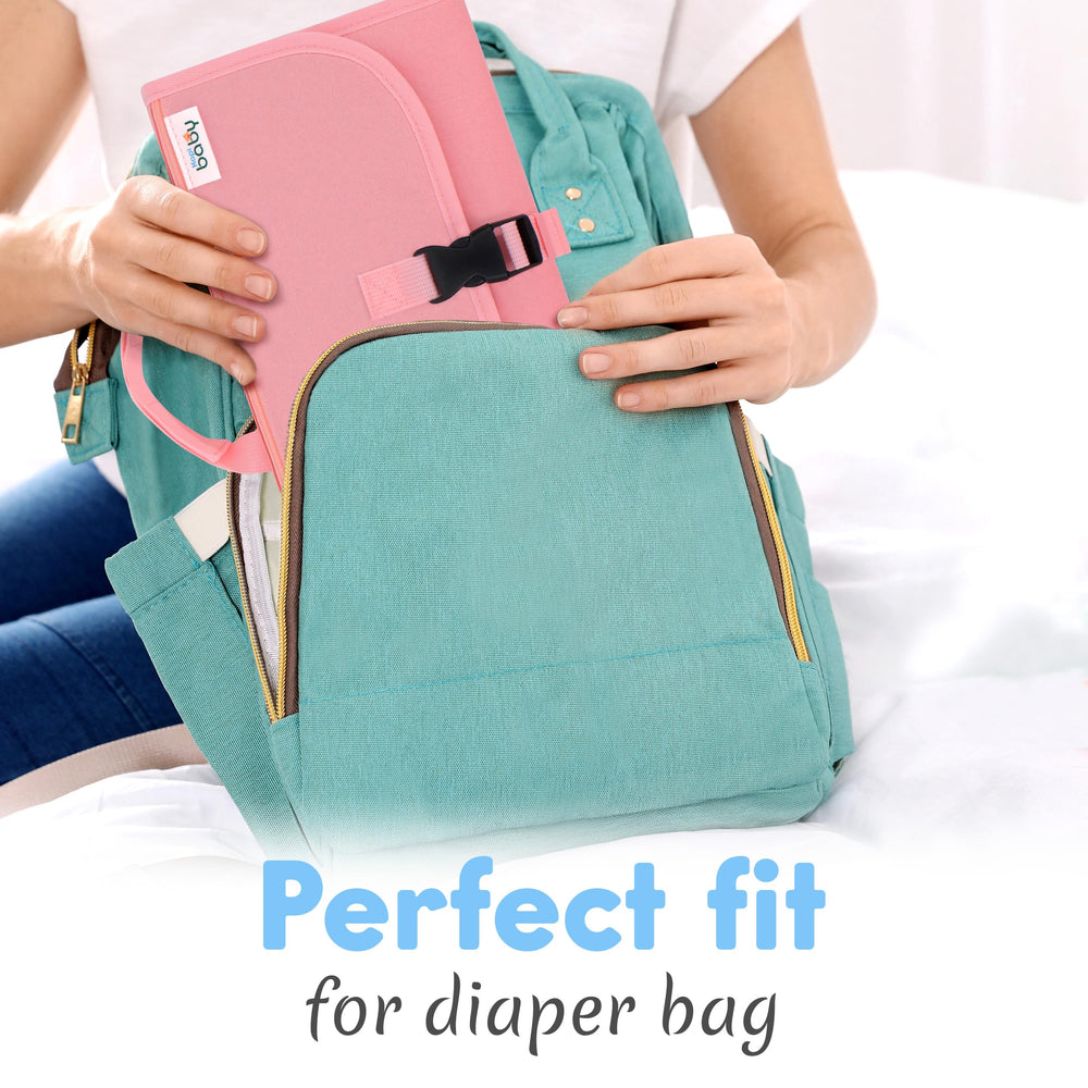 Kopi Baby changing kit includes two large pockets for diapers, creams, and wipes.