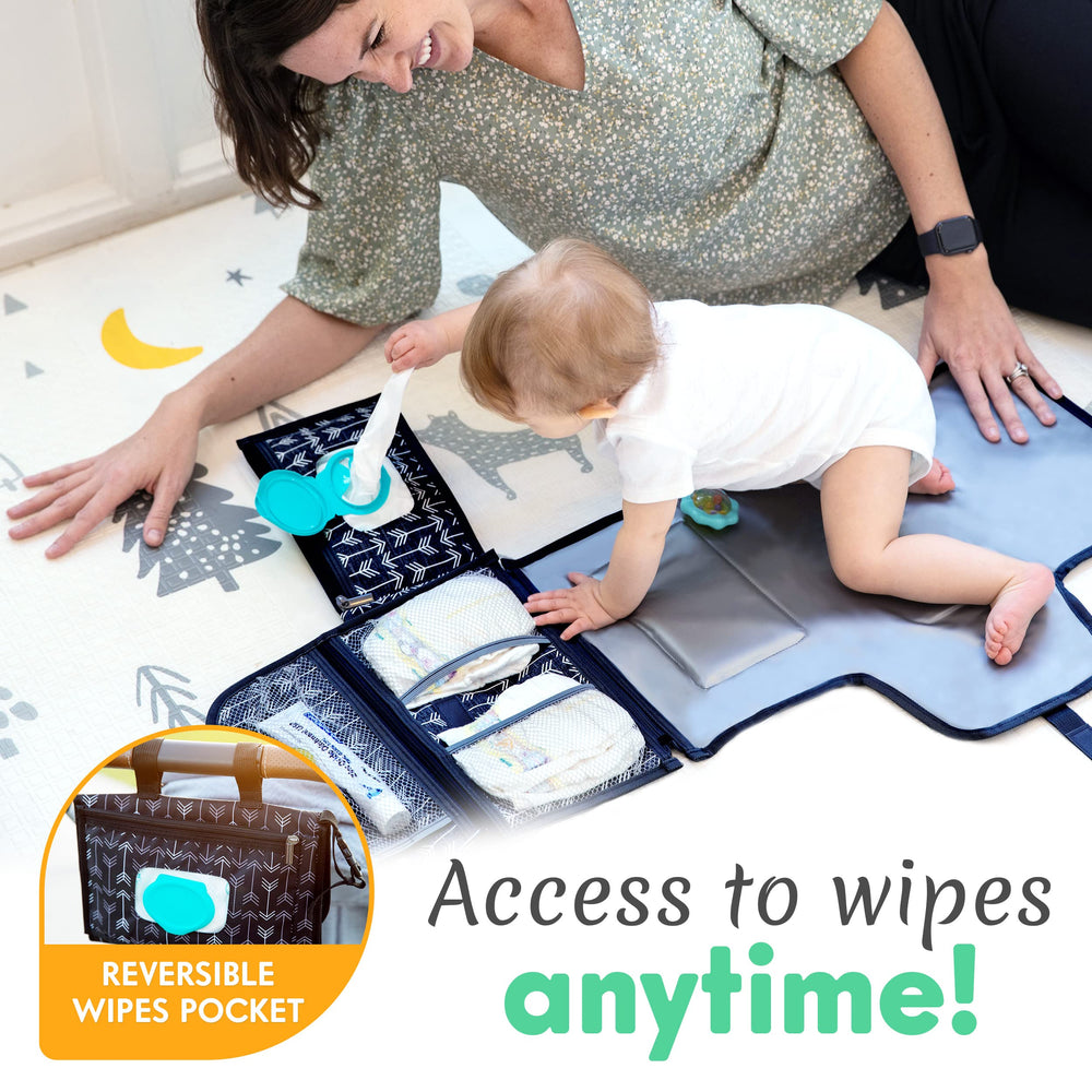 Kopi Baby changing mat with stroller attachment Velcro straps for convenient travel use.
