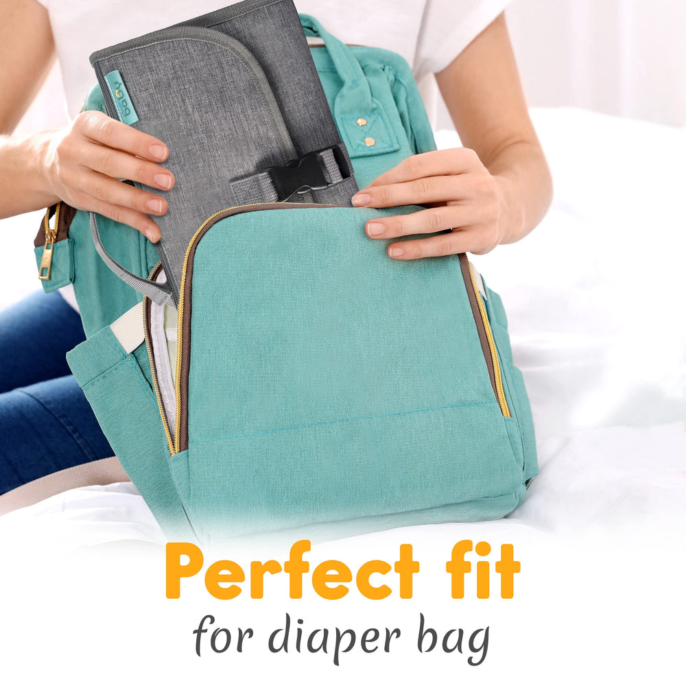 Kopi Baby changing pad features large pockets for baby essentials and organization.