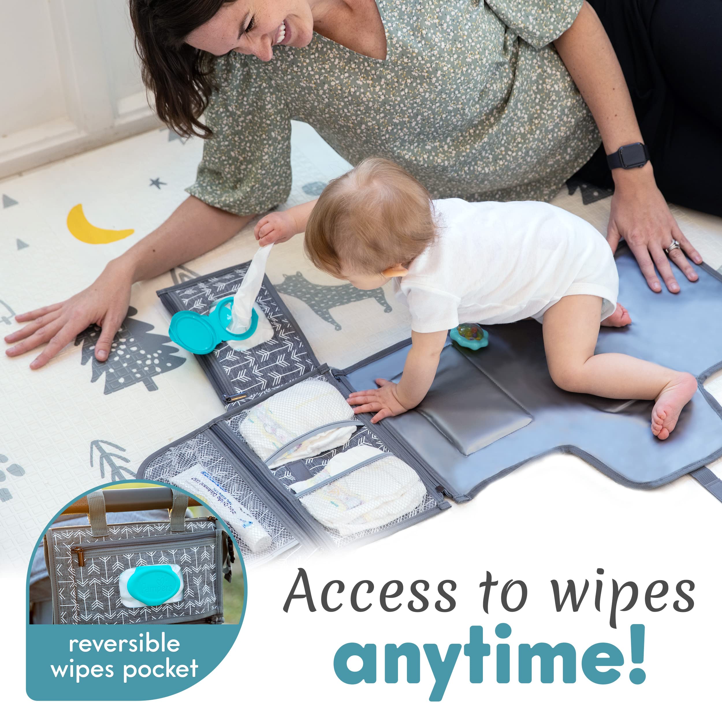 Kopi Baby changing pad attached to a stroller with Velcro straps