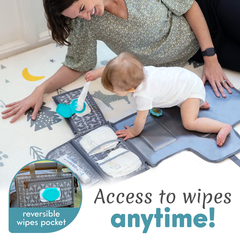 Kopi Baby changing pad attached to a stroller with Velcro straps