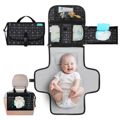 Kopi Baby portable diaper changing pad with built-in pillow for on-the-go diaper changes.