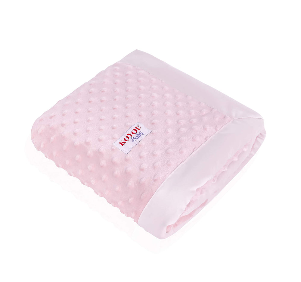 KOYOU Baby Pink blanket draped over a stroller for on-the-go comfort.