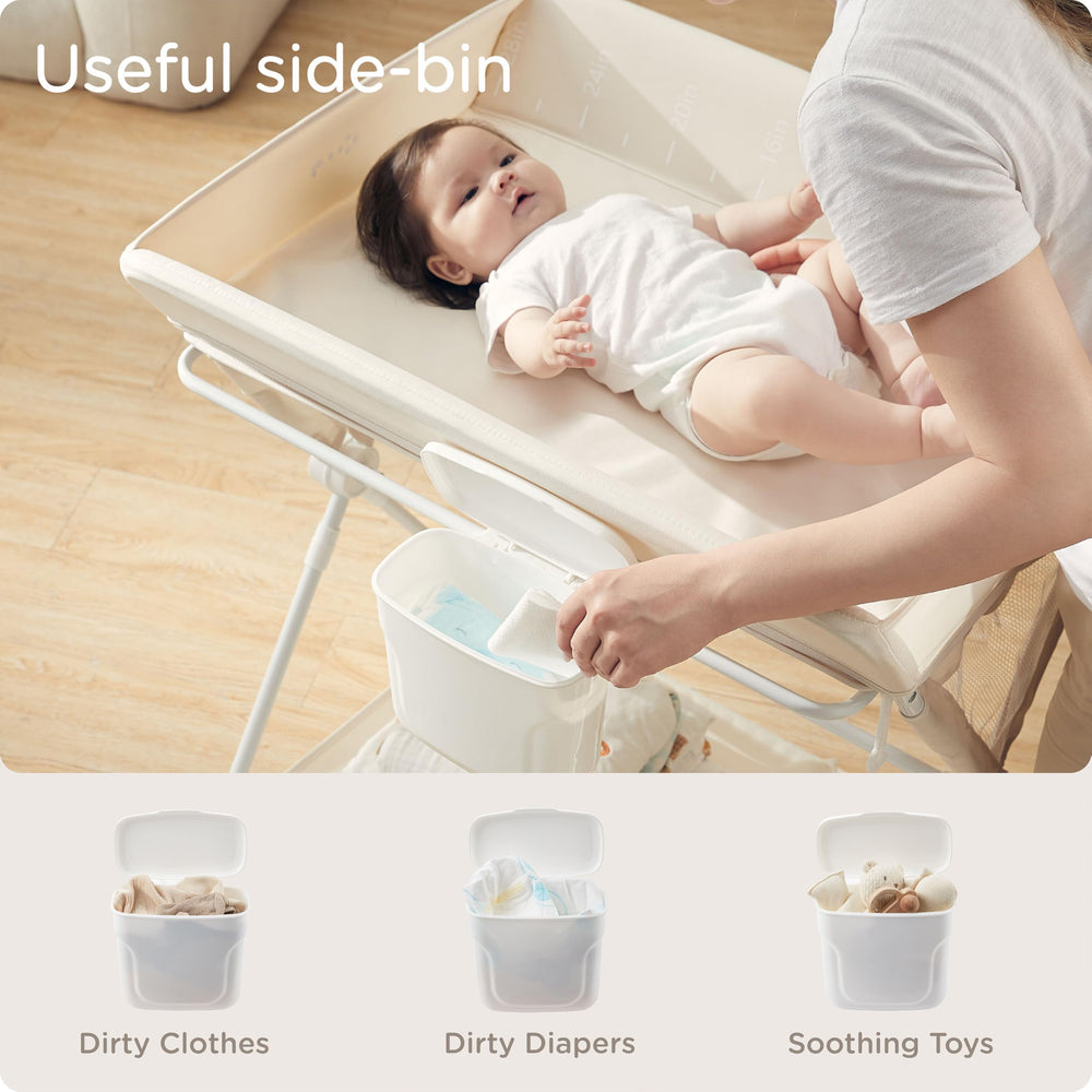 KUB portable changing table in use, wheels roll smoothly between rooms.