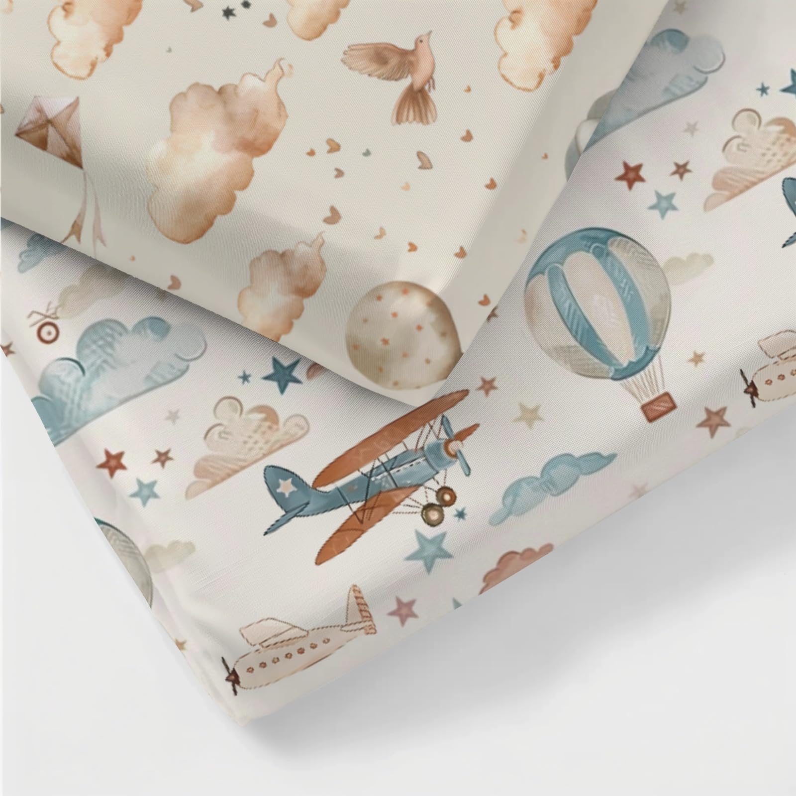 KuphiL10C clouds and stars pattern crib sheet close-up creates a soothing, cohesive nursery.