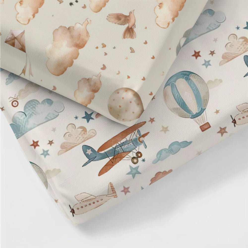 KuphiL10C clouds and stars pattern crib sheet close-up creates a soothing, cohesive nursery.