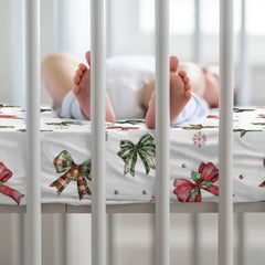 KuphiL10C Snug-fit crib sheet with elastic band secures the mattress.